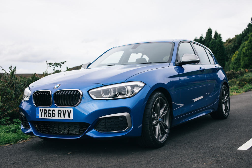 Blue BMW M140i on road