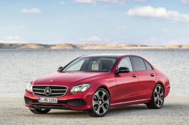 Red Mercedes E Class on the beach