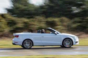 Audi A3 Cabriolet with roof down racing