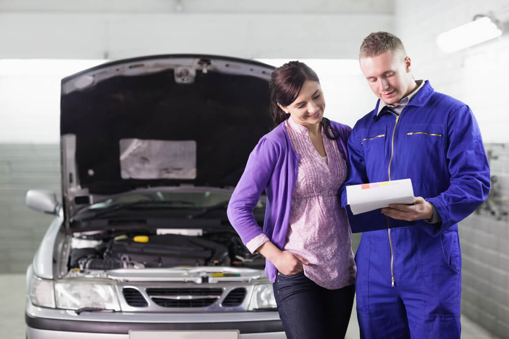 woman getting her car serviced