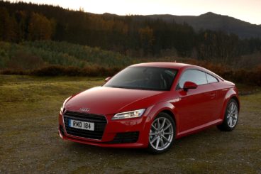 Red Audi TT parked on Grass