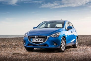 Mazda 2 Hatchback in blue parked in middle of desert