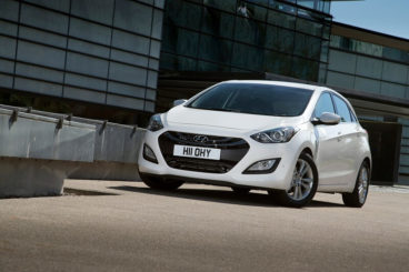 white Hyundai i30 front view parked low angle