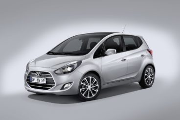 a silver hyundai ix20 hatchback isolated on a white and silver background