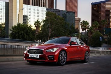 Infiniti Q50 Saloon side view driving through city