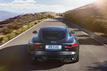 Jaguar F-Type Coupe back view driving on mountain road