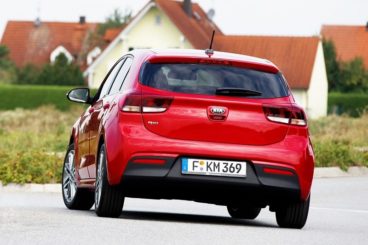 Kia Rio back view driving