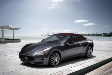 Maserati Gran Cabrio roof up parked by beach
