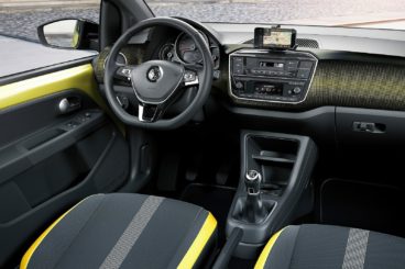 the black and yellow interior of the volkswagen up hatchback