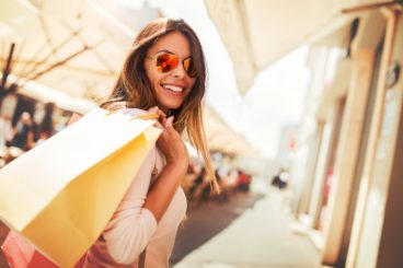 Woman in shopping. Happy woman with shopping bags enjoying in shopping.