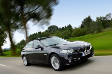 BMW 520d driving on road fast