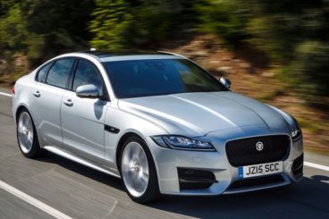 Jaguar XF driving on road