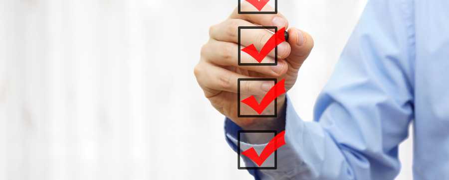 Man checking off items on a checklist