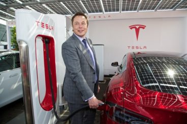 Man charging his tesla