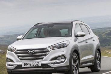 Hyundai Tucson driving on road