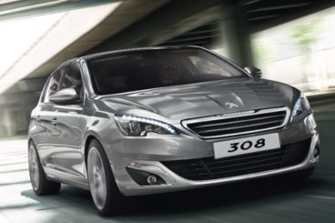 Peugeot 308 driving on road