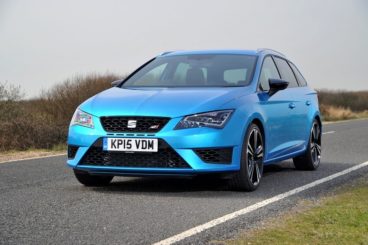 SEAT Leon Sports Tourer Estate in teal blue driving on the road