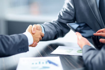 two people shaking hands