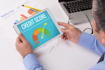 A man looking at his credit score