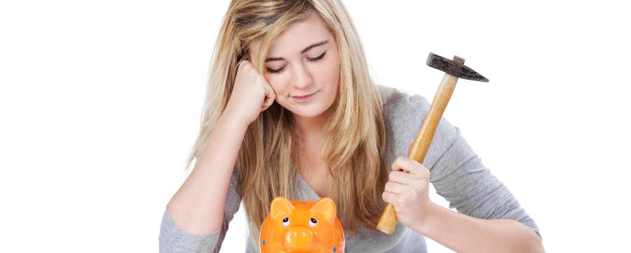 Girl with a hammer looking at a piggy bank car leasing for students