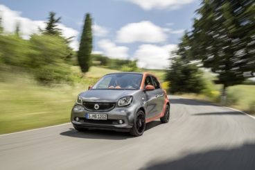 Grey and Orange Smart forfour Night Sky Hatchback driving along a country lane