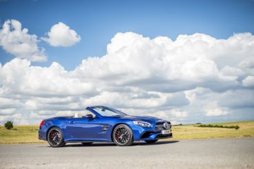 Mercedes AMG in blue parked in middle of road