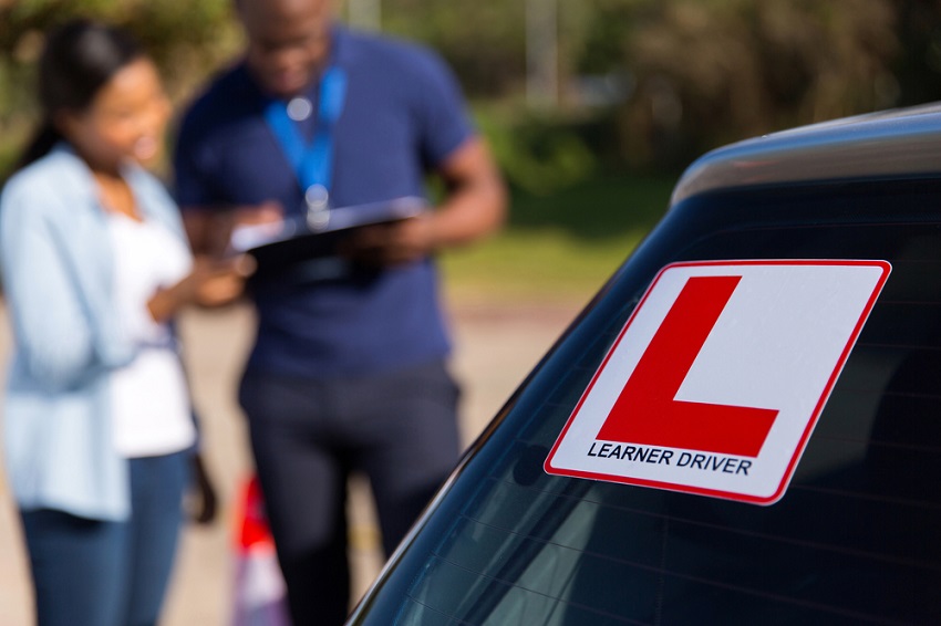 Learner sticker with an instructor and student in the background