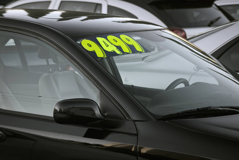 black car with 9499 price in the window