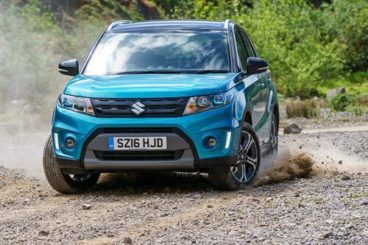 Suzuki Vitara blue front off road on a dirt track