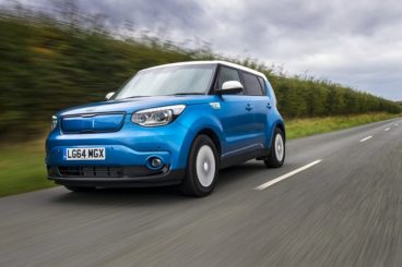 Light ble metallic Kia EV Soul driving
