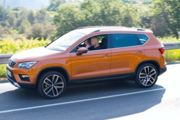 Seat Ateca in orange driving on the road