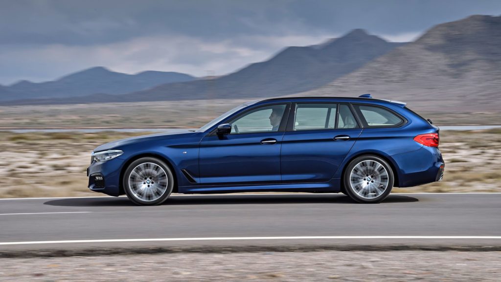 bmw 5 series touring in navy side profile