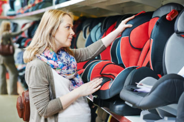 woman looking for car seat
