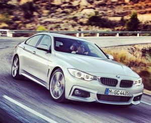 bmw 4 series gran coupe in silver driving