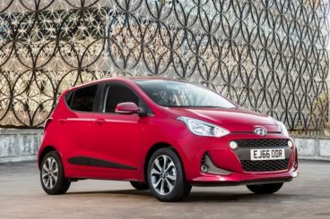 Hyundai i10 in red parked - best car for new drivers