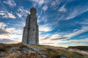Tower on a hill with blue sky