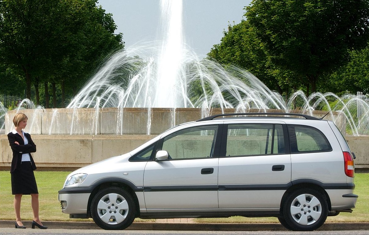 Vauxhall Zafira parked portrait with water fountain in the background and business woman standing beside the vehicle