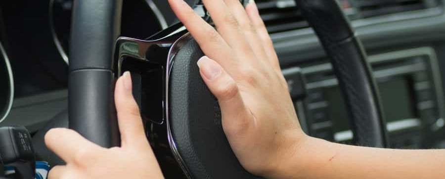 Woman blasting her car horn