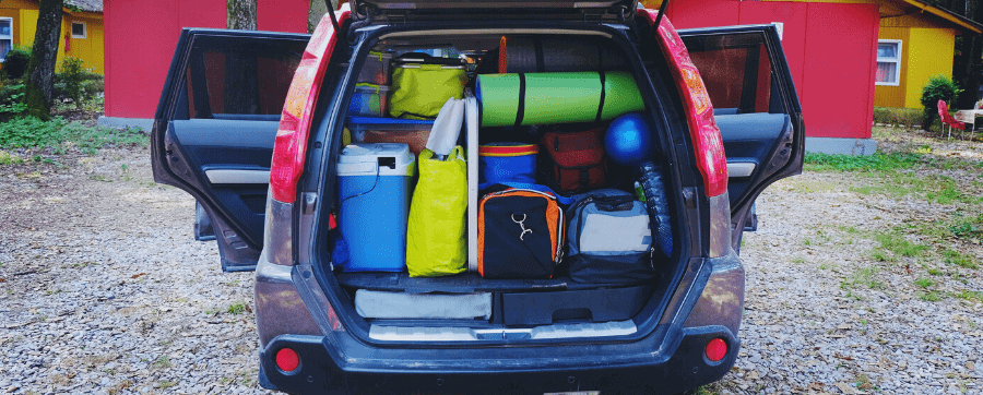Picture of a full car boot, loaded with supplies
