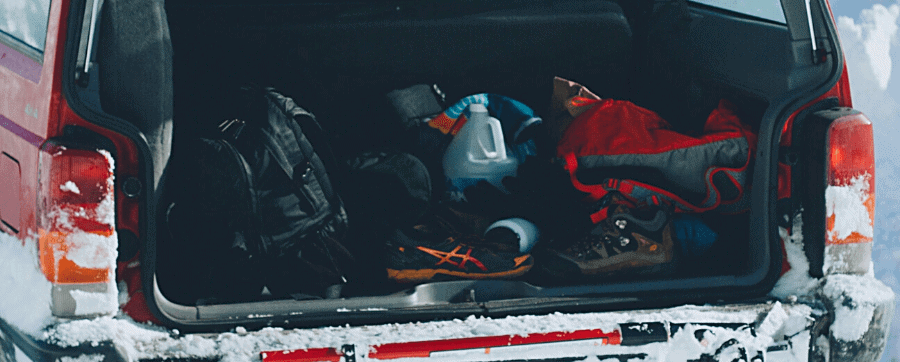 Picture of a snowy car boot with equipment inside