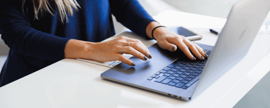 Close up of woman using a laptop