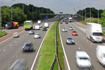 picture of a motorway in the daytime with cars driving quickly