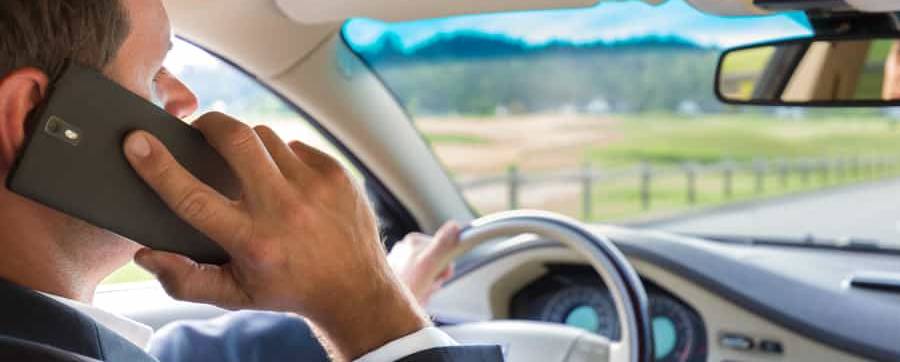 Man using a phone while driving