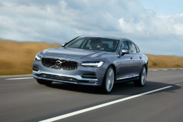 Volvo s90 mussel Blue driving down country road