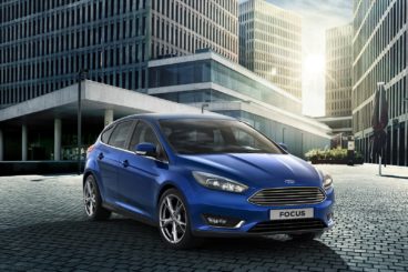 blue Ford Focus in a city