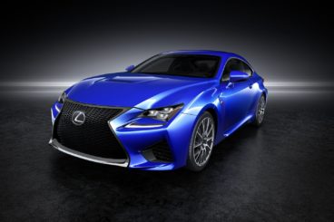 metallic blue lexus r cf coupe isolated on black background with white light through the middle
