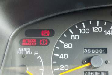 car dashboard showing warning signs - top 10 safe cars