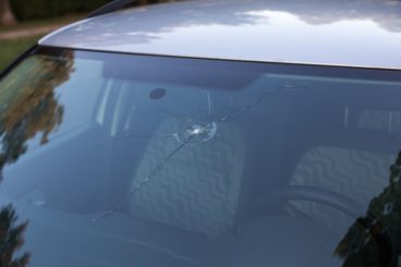 big chip on windscreen of dark silver car