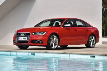 Red Audi S6 by the pool side