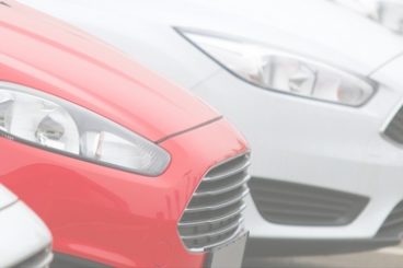 edited picture of one ford fiesta amongst other white ford fiestas with the title what are fleet vehicles